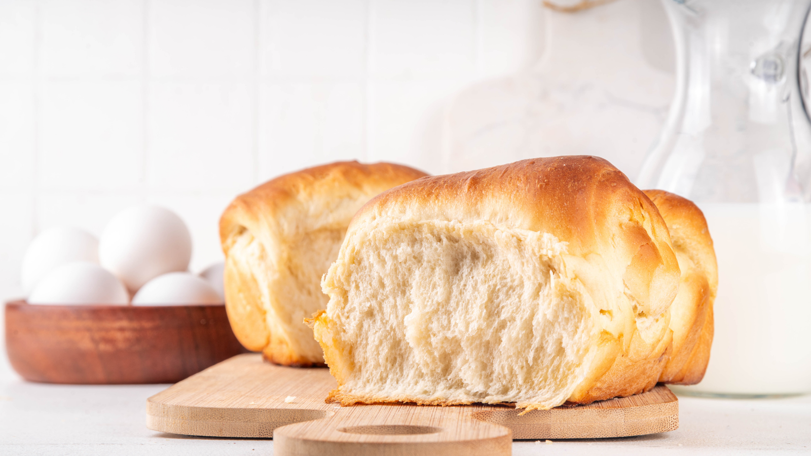 Soft milk bread loaf with a tender, fluffy crumb demonstrating how milk creates a rich, bakery-style texture